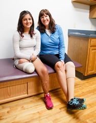 Boston Marathon Bombing survivor Karen Rand sits with Estefania Salinas as she waits for new prosthetic leg to be created at Next Step Bionics and Prosthetics in Newton, Mass. March 13, 2014.
Photo by Gregory L. Tracy
